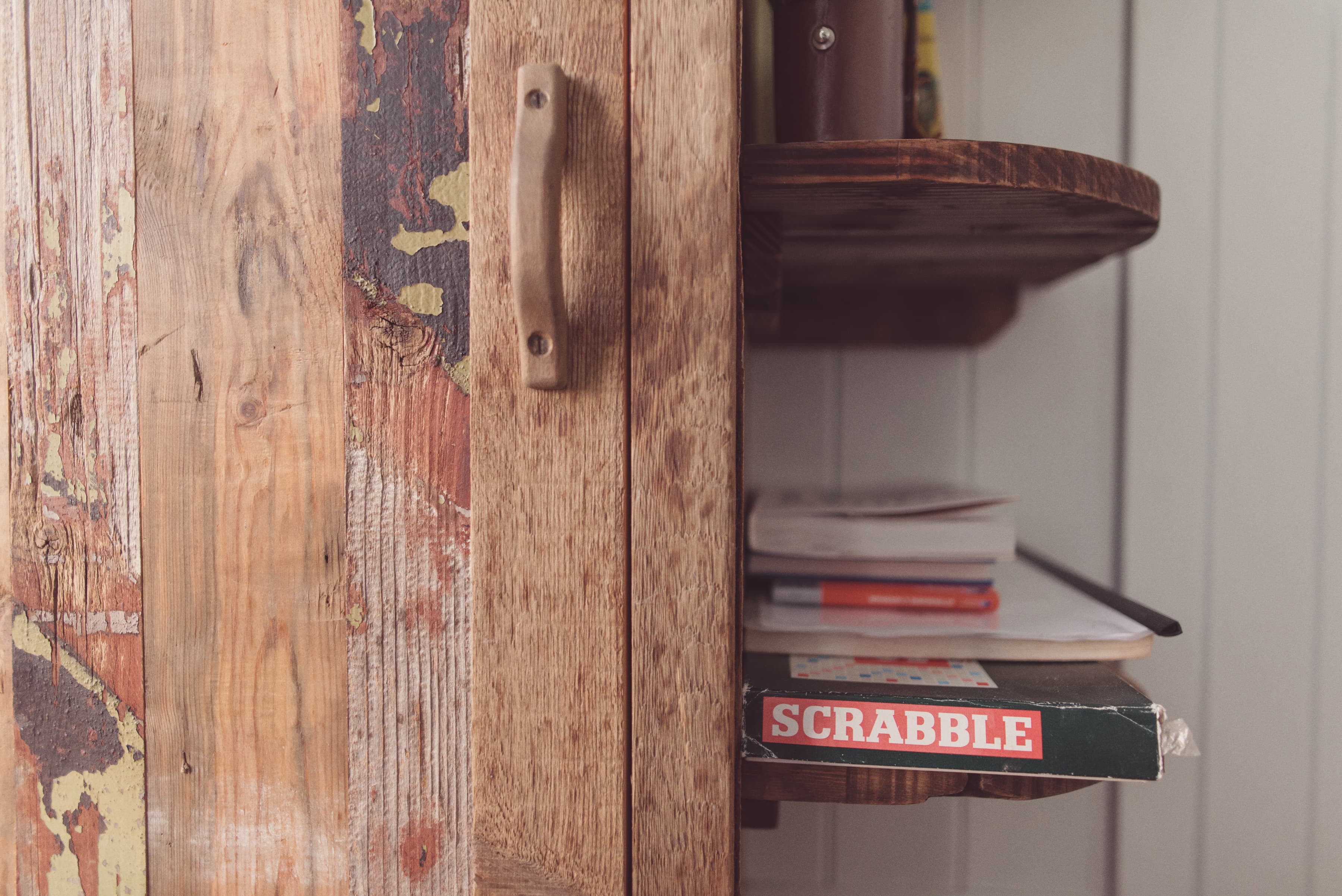 shelf with books and board games