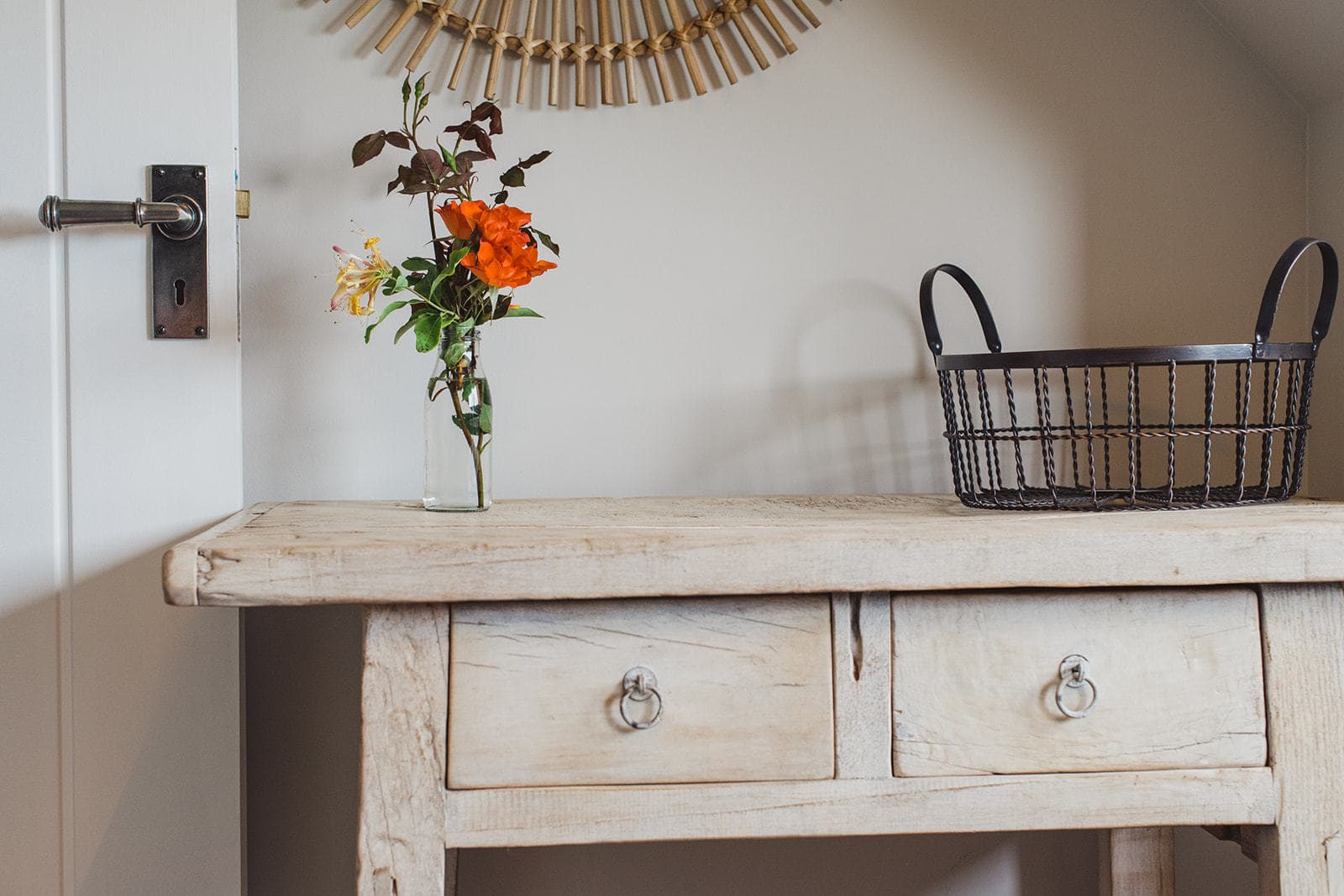 desk with flowers and basket