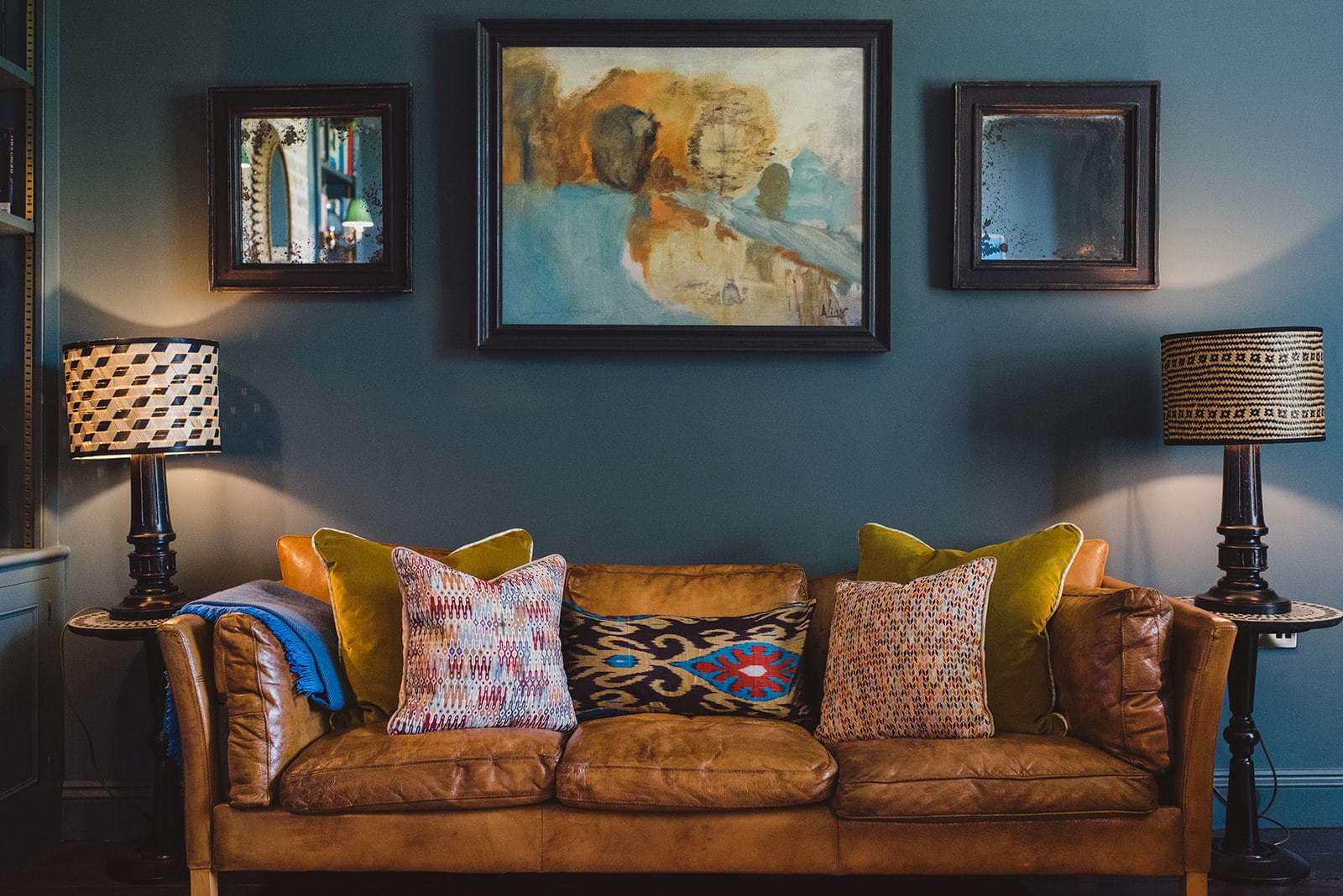 couch under painting and mirrors