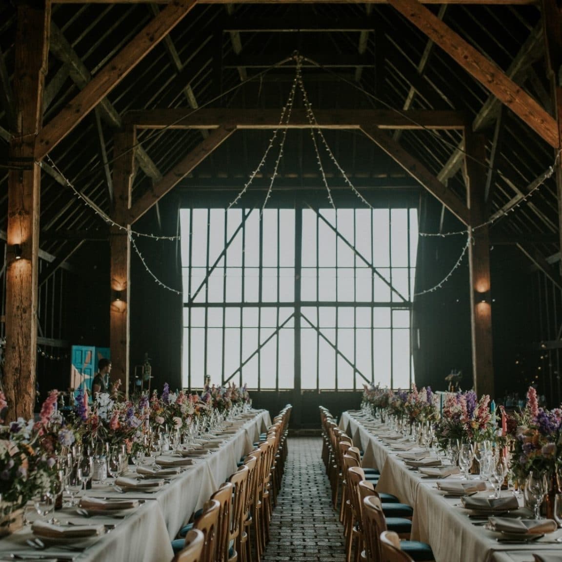 Wedding breakfast in a rustic barn wedding