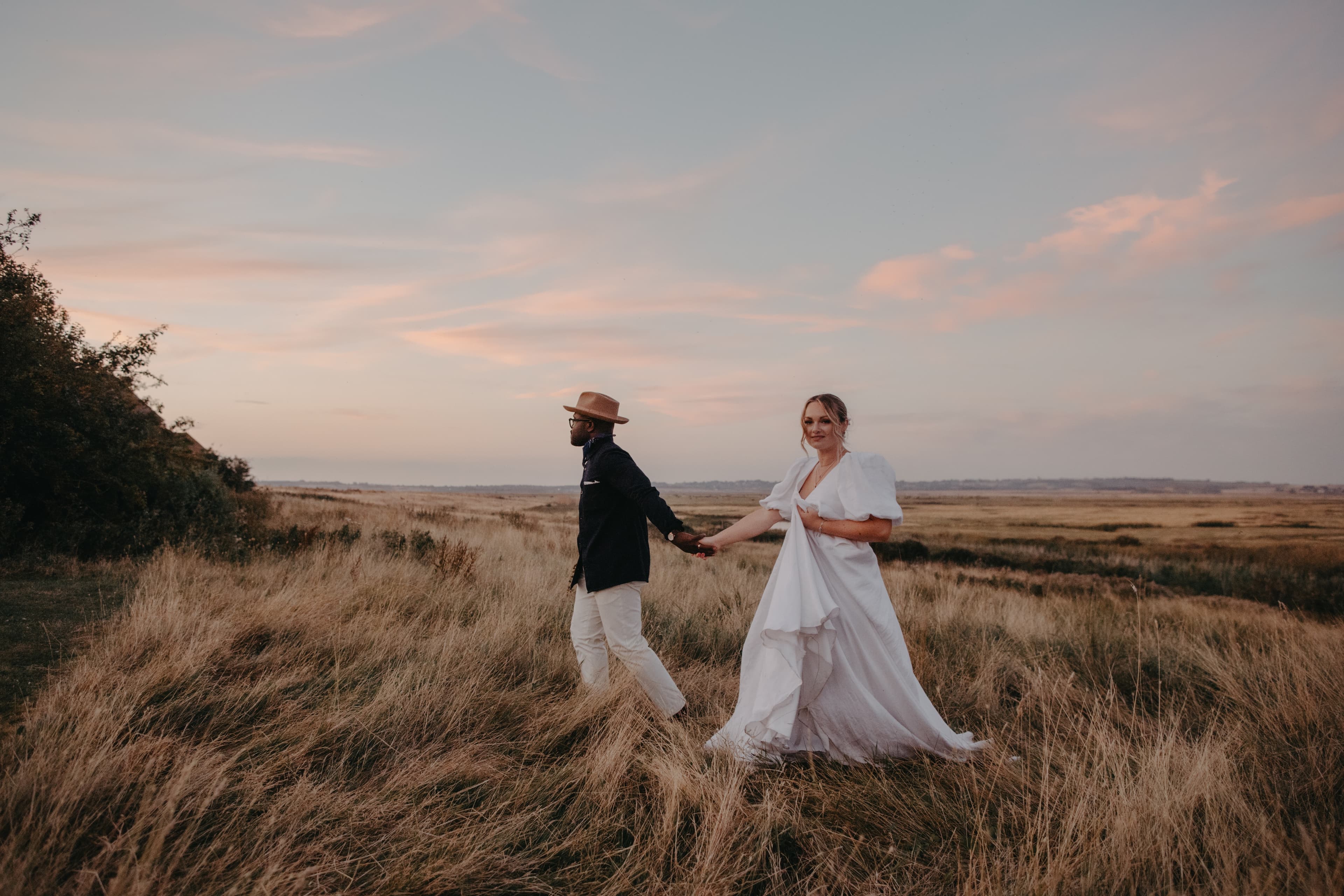 Couple walking across the miles of Nature Reserve at Elmley