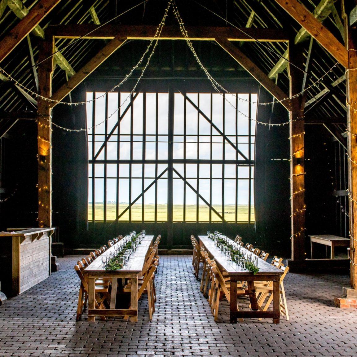 Kingshill Barn set up for feasting dinner corporate event