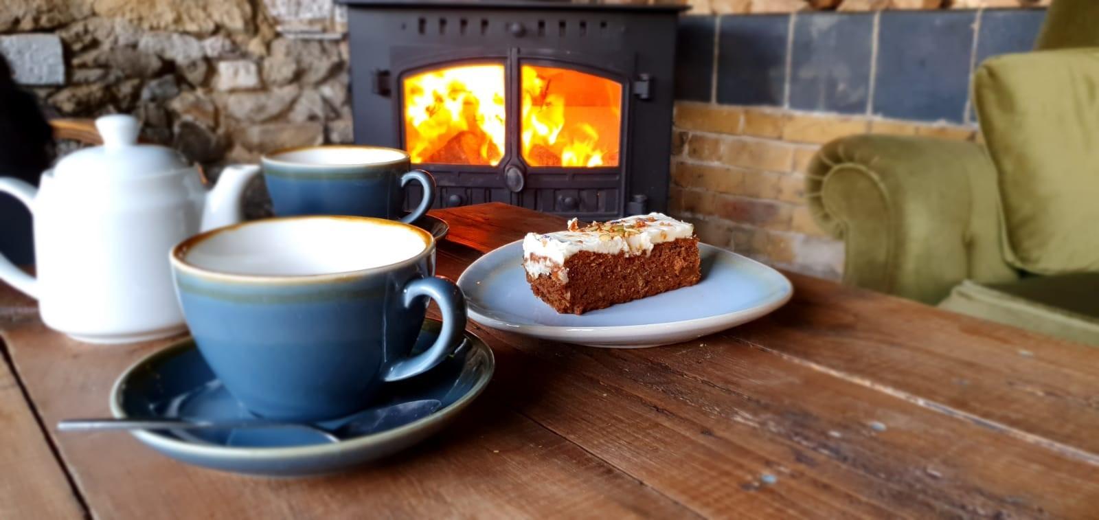 Cake and fire in the cowshed cafe